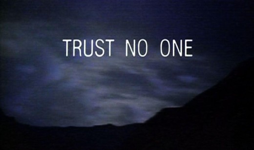 A closing scene from an episode of The X-Files showing an overcast dusk with a mountain in the background. White text on the screen reads Trust No One
