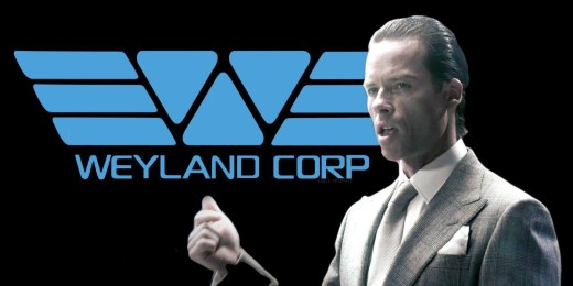 Peter Weyland, portrayed by Guy Pierce, stands in front of a sign for Weyland Corporation